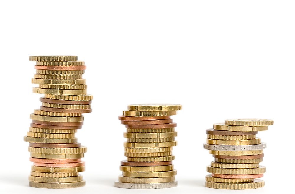 Three stacks of euro coins on white background